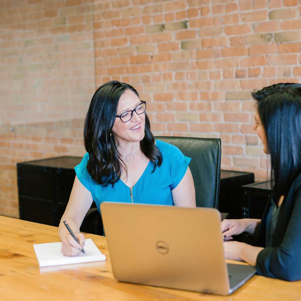 Two women having a meeting in a conference room