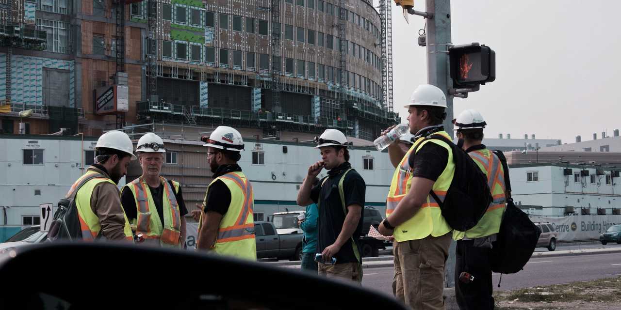 Workers gathered on the pedestrian road