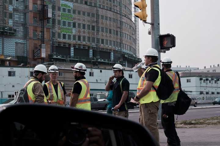 Workers gathered on the pedestrian road