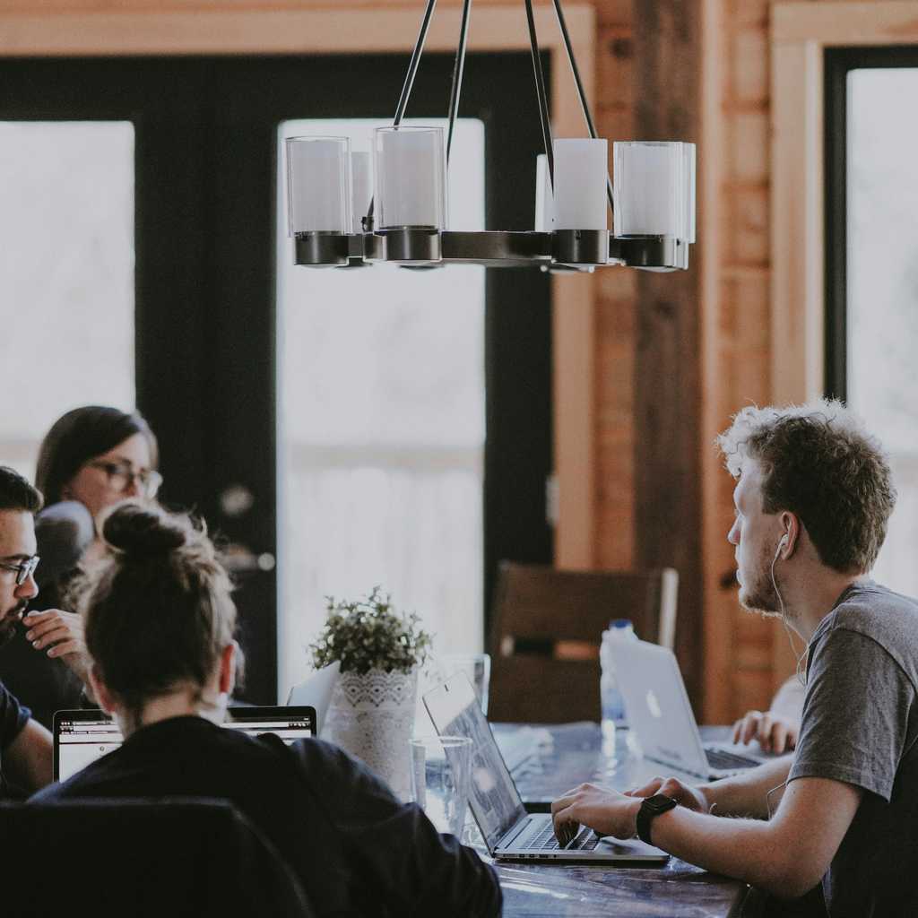 People having a meeting in a cottage