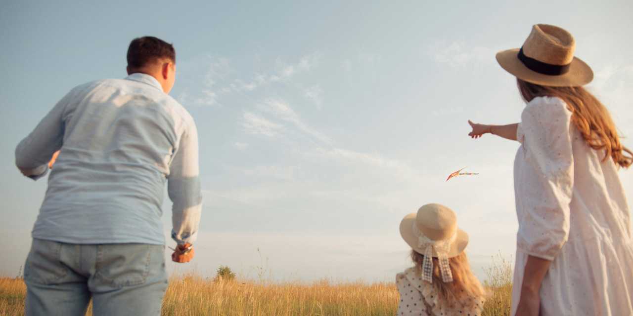 Family flying a kite