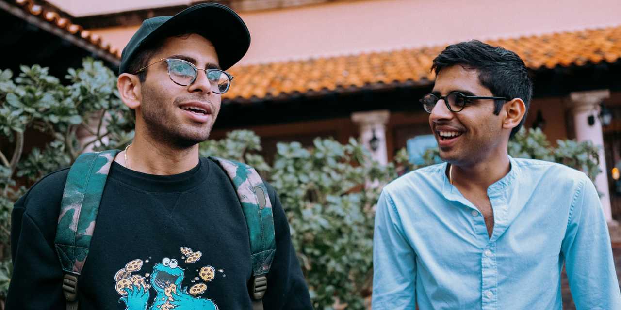 Siblings hanging around in a courtyard