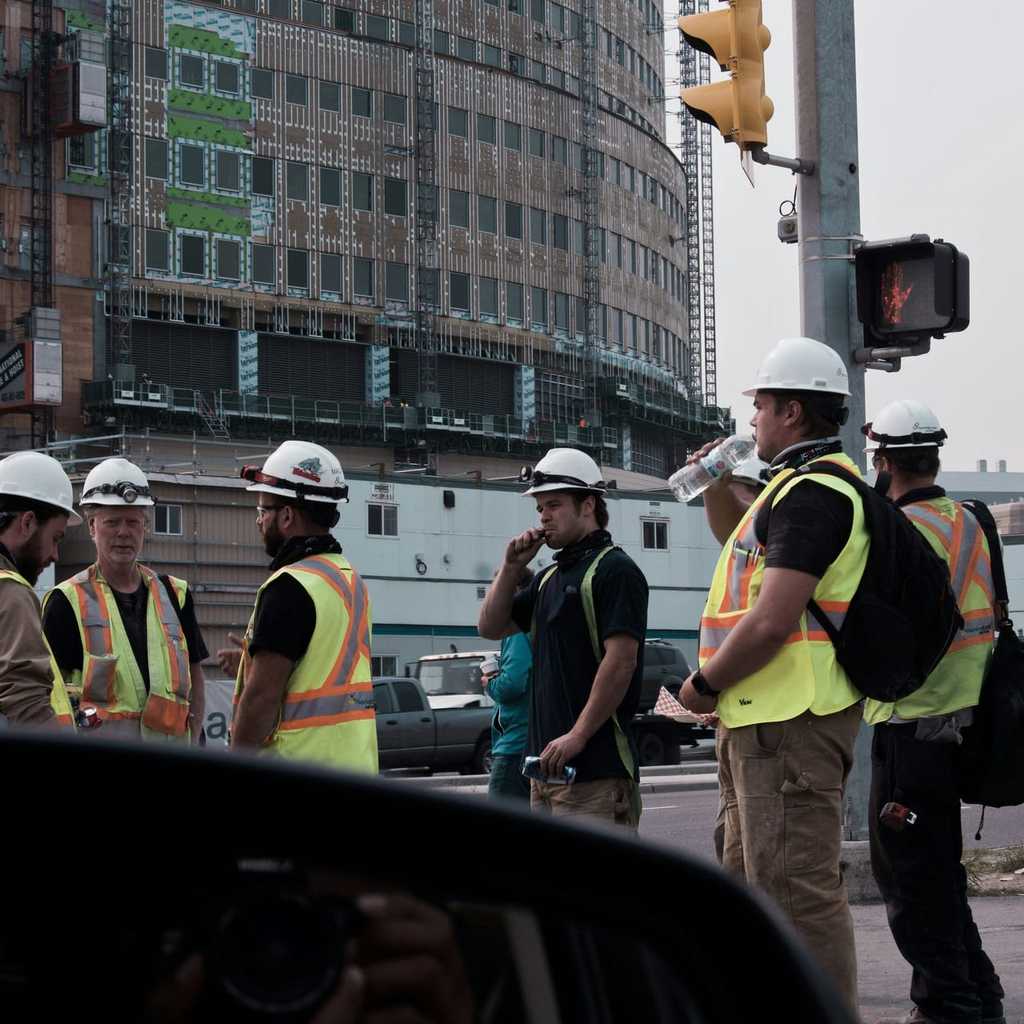 Workers gathered on the pedestrian road