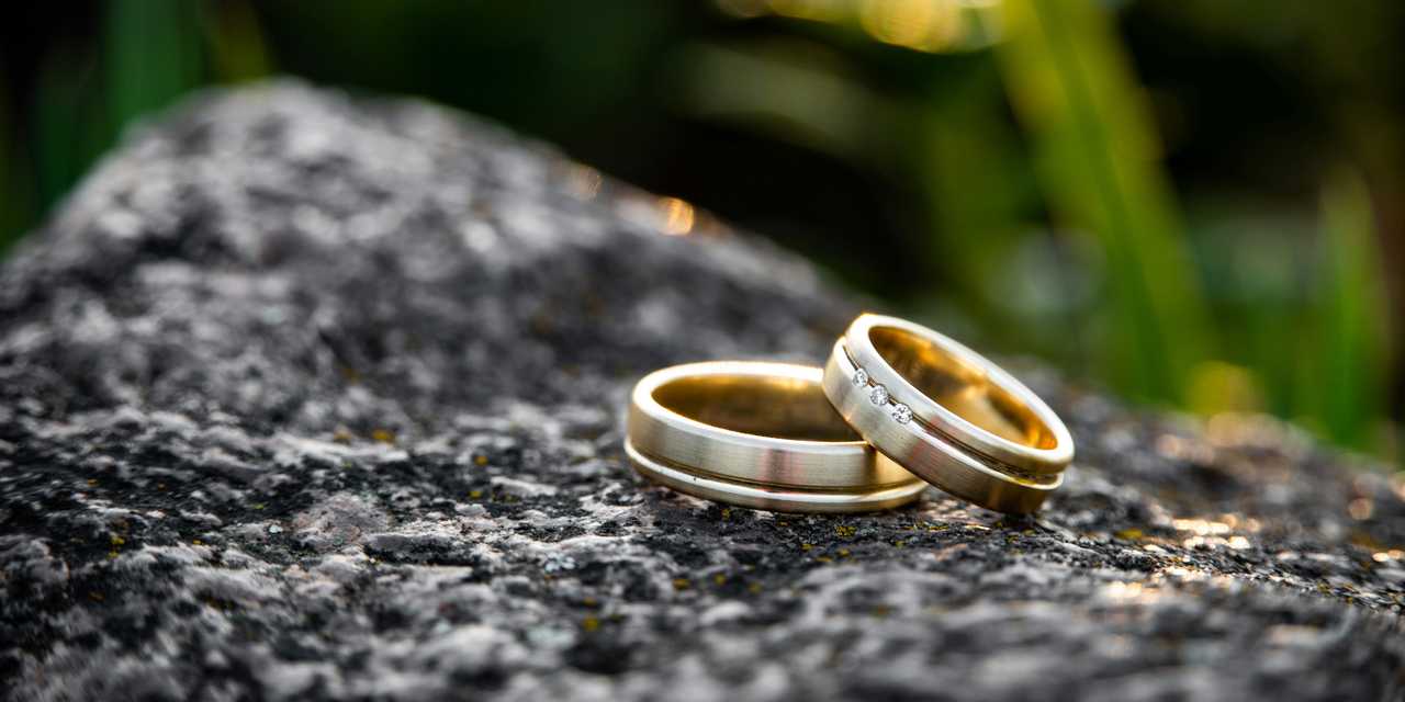 Wedding rings on a rock