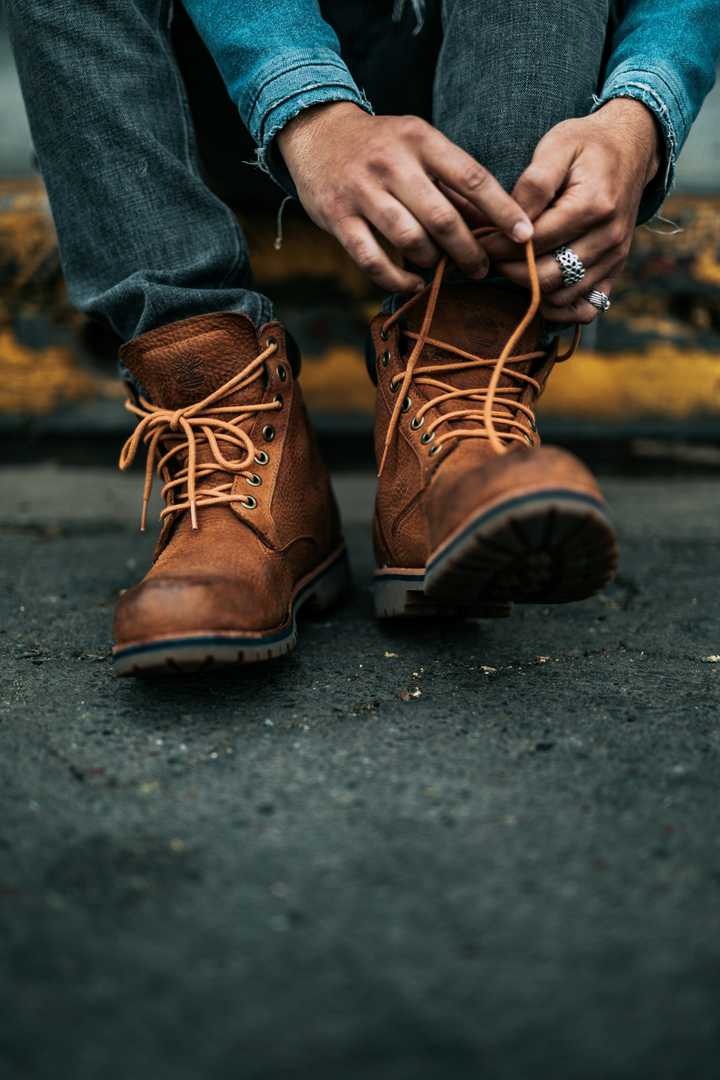 A person tying shoe laces