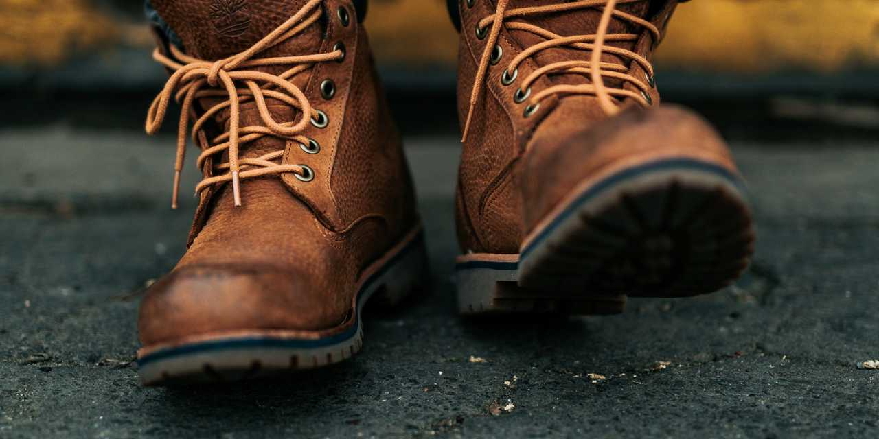 A person tying shoe laces